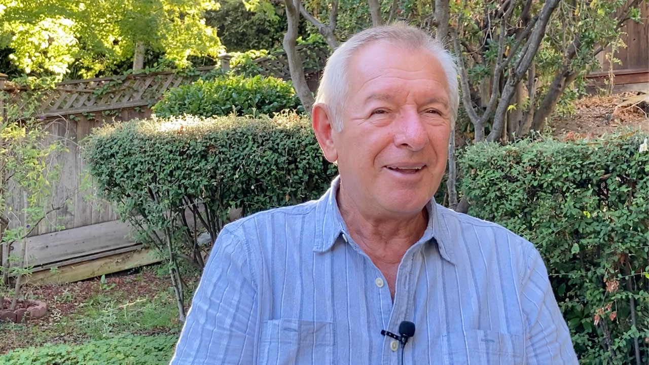 George Bocsan sitting for interview in his garden