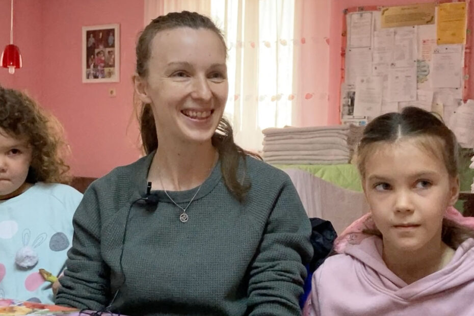 Anna and two of her children in Ineu Romania sitting for interivew