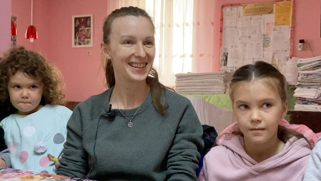 Anna and two of her children in Ineu Romania sitting for interivew